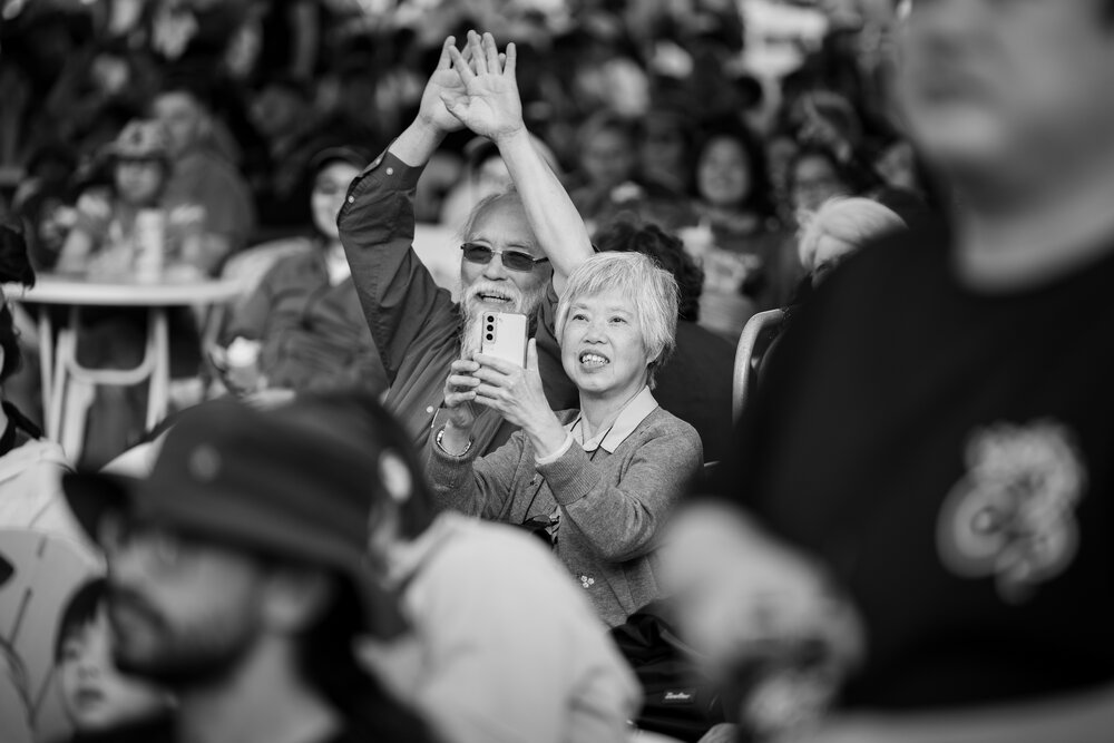 Granny Smith Festival 2025: elderly Asian couple enjoying the main stage performers