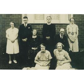 Ekerick family standing in front of new house
