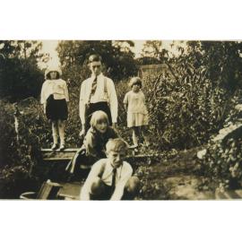 The Ekerick children playing in the pond 