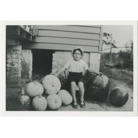 Gordon Millar with melons and pumpkins grown by his father William at the back of the Millar family home, 31 (now 28) High Street Gladesville