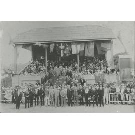 Crowd gathered for opening ceremony at grandstand in Monash Park, Gladesville