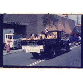 Classic truck with children in sitting in the back, Granny Smith Festival parade
