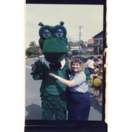 St George Bank dragon posing with a girl guide, Granny Smith Festival parade