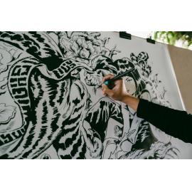 Chris Yee working on his artwork for the Granny Smith Festival