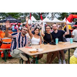 Group enjoying the food and festivities at the Lunar New Year Festival, 2025
