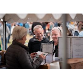 Couple at one one the wine stalls at the Cork & Fork festival, Putney