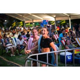 Teenage girls enjoying the evening show at Ryde's Backyard Barbeque, Australia Day 2024