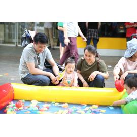 Family playing 'go fish' at the Granny Smith Festival, 2019