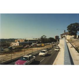 Streetscape of Devlin Street looking north during construction of Victoria Road underpass, Ryde, February 1997 