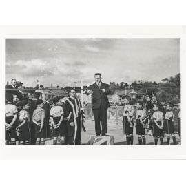 The Honourable B S B Stevens, Premier of NSW, cutting the ribbon to open Ryde Bridge, 7 December 1935  : with Ryde Mayor W Harrison and members of the Ryde Squadron Australian Air