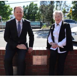Mayor Trenton Brown and De'ann Hespe unveiling a plaque for the 40th anniversary of the Granny Smith Festival