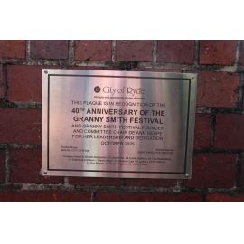Plaque commemorating the 40th anniversary of the Granny Smith Festival and De'Ann Hespe