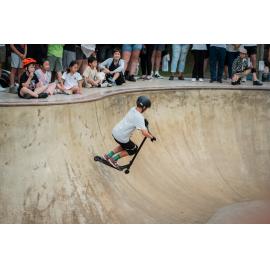Boy riding his scooter in the skateboard bowl, Australia Day 2026