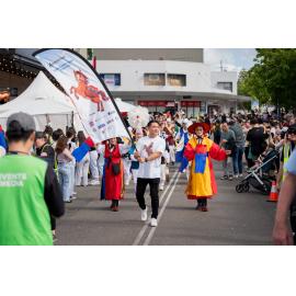 Procession featuring performers in traditional attire moving down Railway Parade at Ryde's Lunar New Year festival, 2026