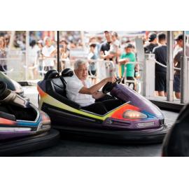 Older adult enjoying a bumper car ride, Lunar New Year Festival, 2026