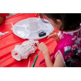 Child making a paper lantern, Lunar New Year Festival, 2026