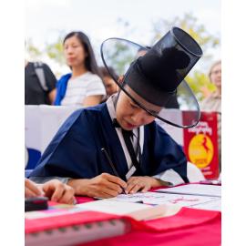 A person wearing traditional Korean attire, Lunar New Year Festival, 2026
