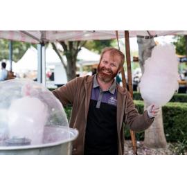 Stallholder preparing fairy floss, West Ryde Easter Celebrations