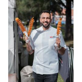 Man with chips on a stick, festival food at West Ryde Easter Celebrations