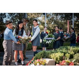 School children laying wreaths at the Anzac Day Service, Anzac Park, West Ryde