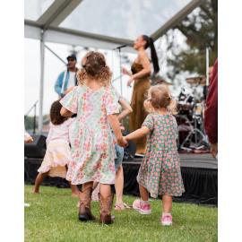 Little girls dancing and enjoying the music at the Cork & Fork festival, Putney
