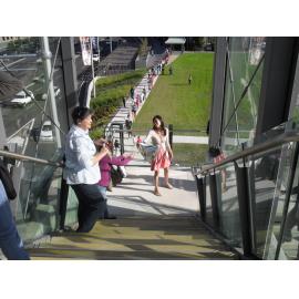 New Ryde Library community book pass participants on the stairs to the pedestrian bridge