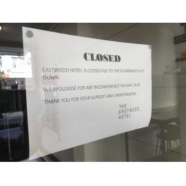 Signage on the Eastwood Hotel doors, April 2020