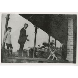 Edward Ernest Benson with his youngest child John Benson on the verandah of "Bensonville"