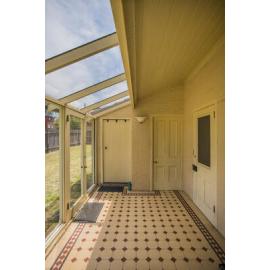 The conservatory of "Speen" with it's tiled floors and glass windows