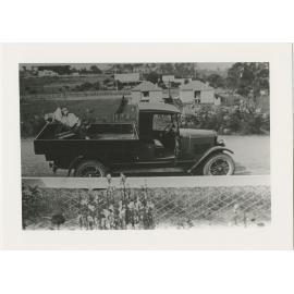 George Horton in deck chair in back of truck parked outside Horton house in Buffalo Road, Ryde